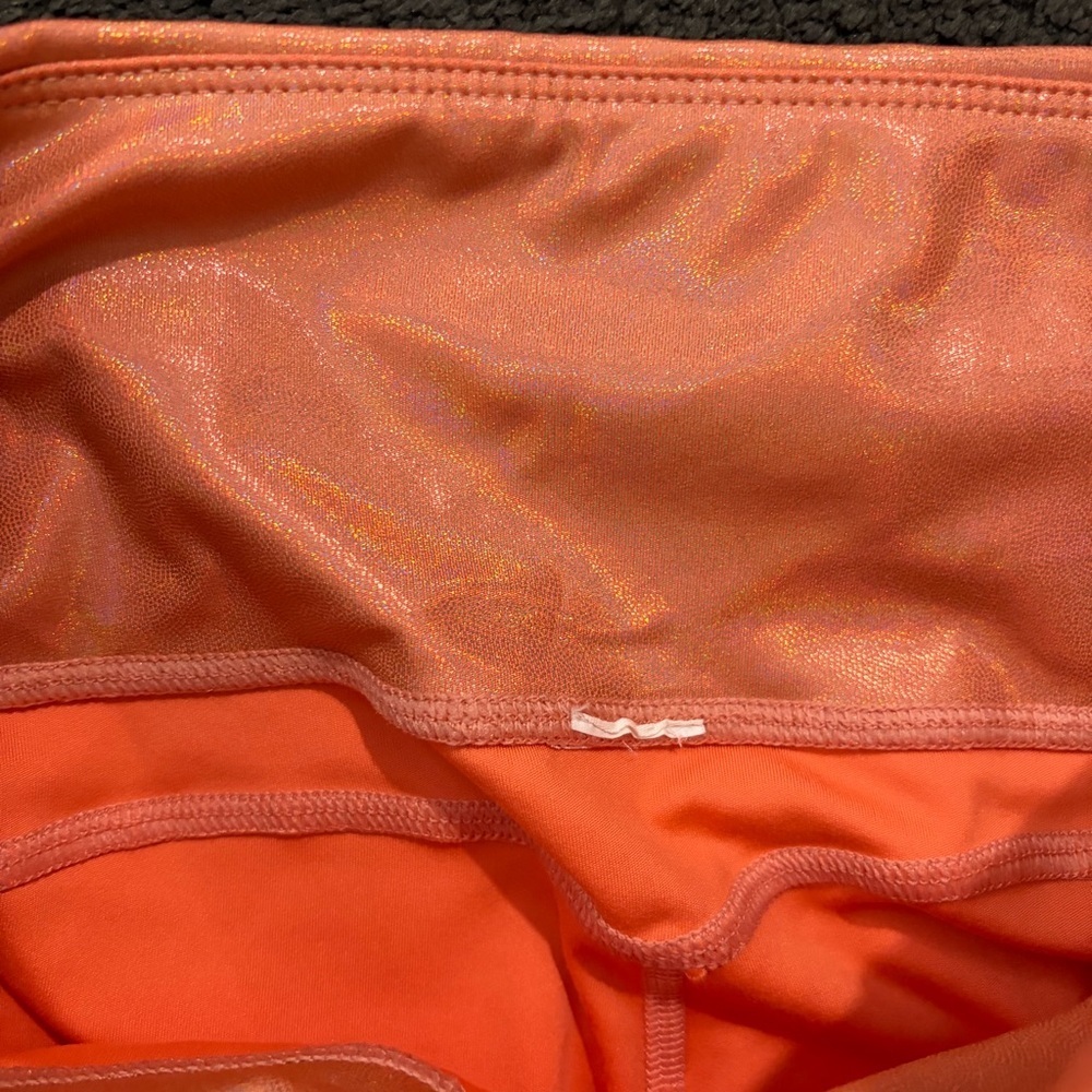 Fabletics Iridescent Peach-Coral High-Waisted Leggings - Picture 9 of 16